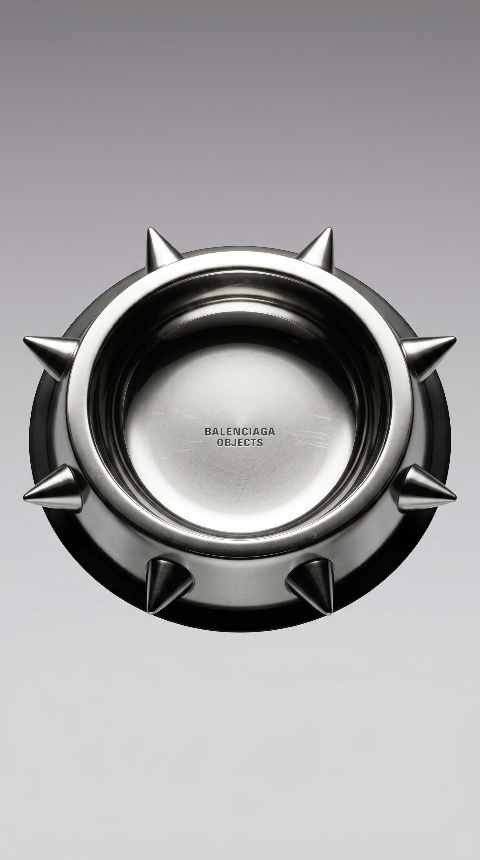 Top down view of the polished stainless steel Balenciaga Spike Bowl with its ring of pointed studs