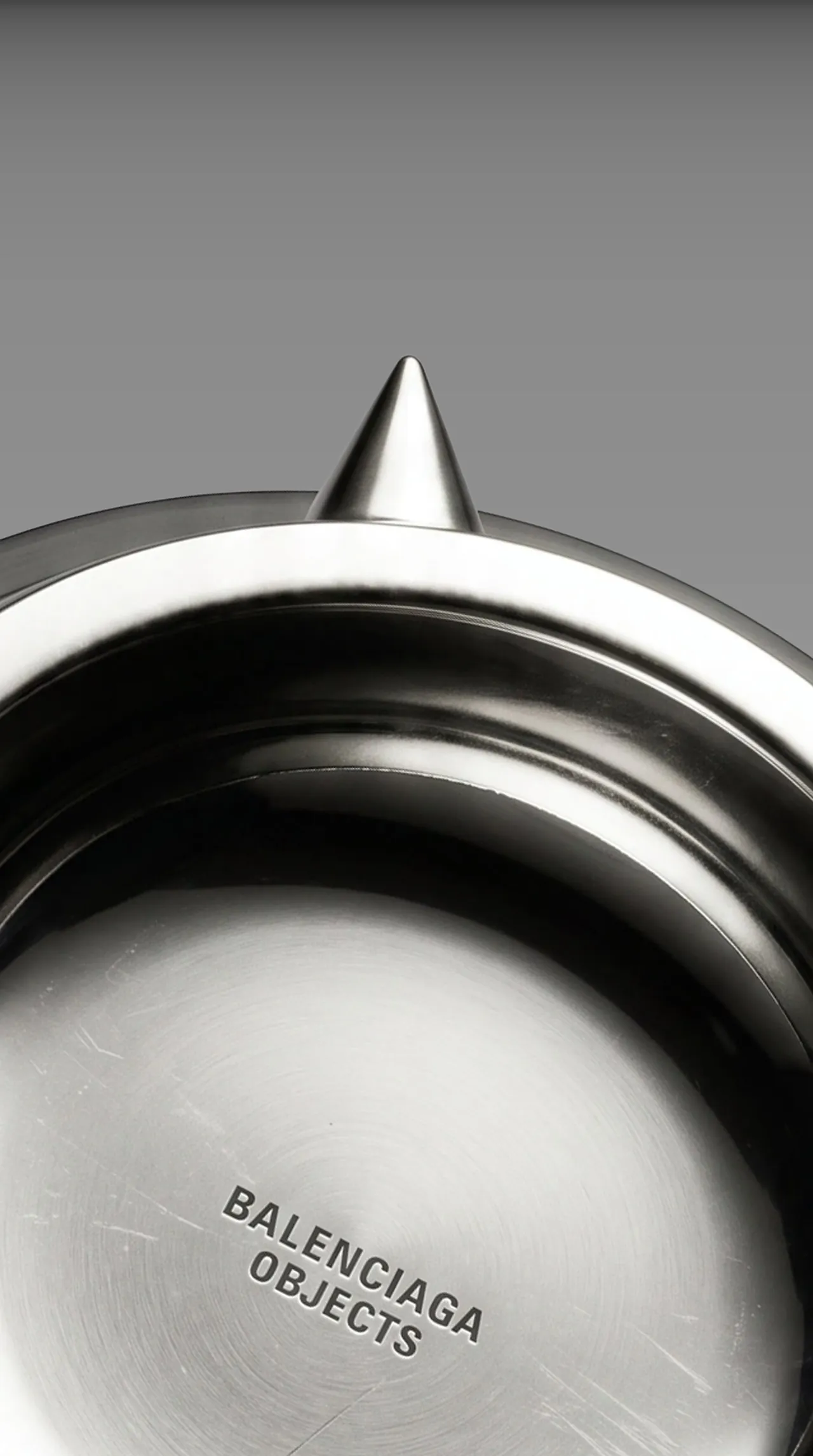 Close-up of the bowl rim with a steel spike and the Balenciaga Objects engraving
